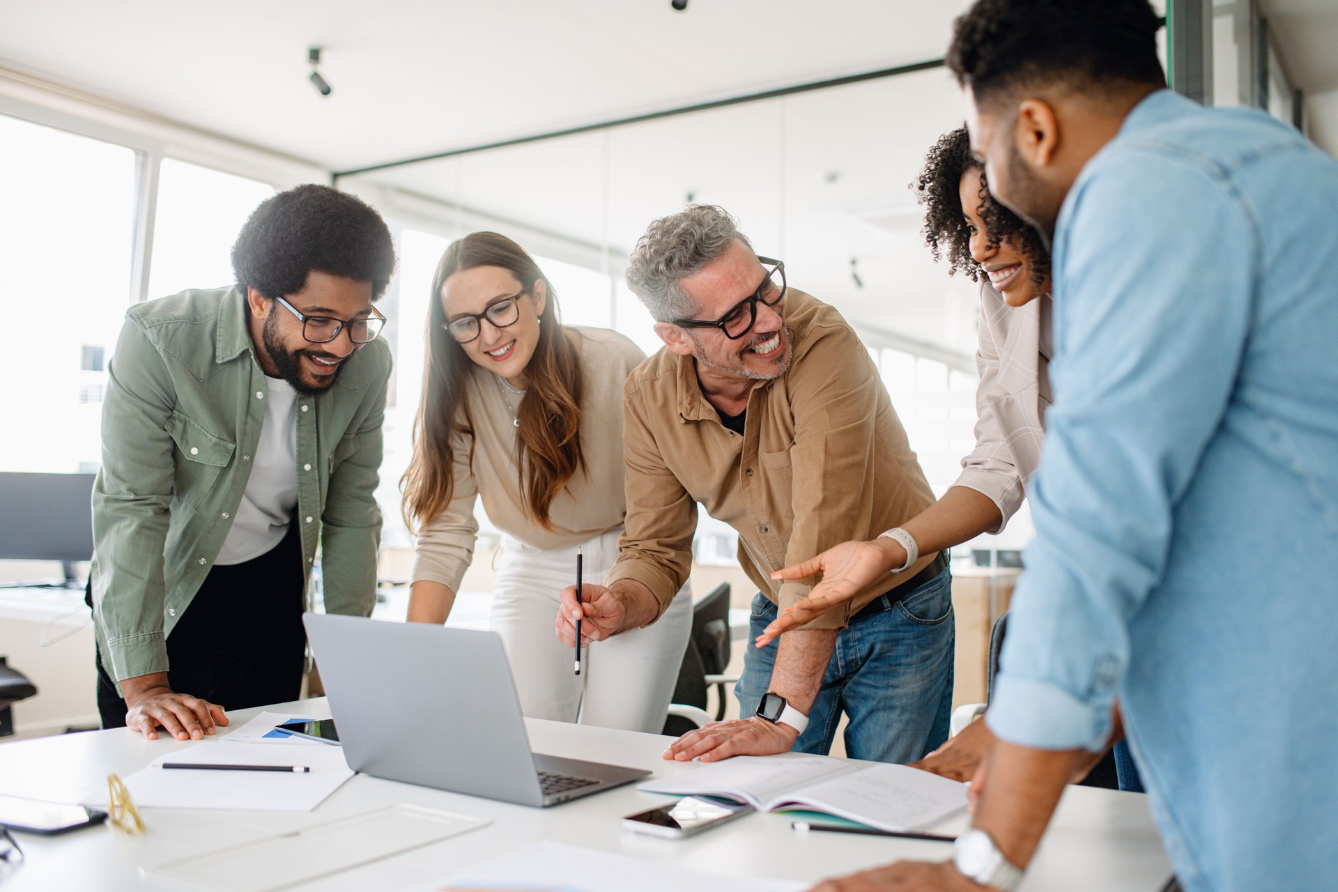 Business professionals actively discussing ideas and strategies during a corporate meeting.